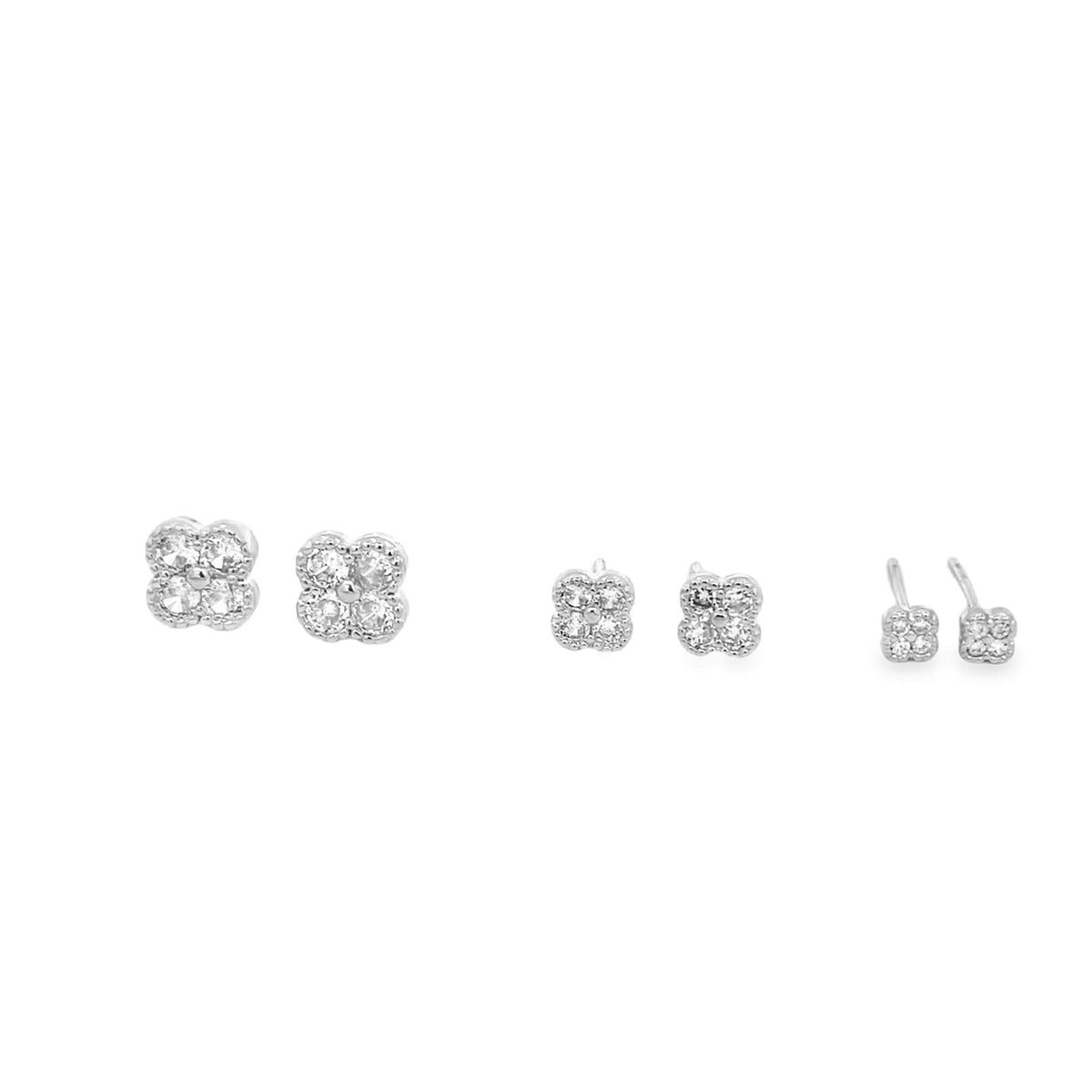 Three pairs of sterling silver flower stud earrings sparkle against a clean white background, showcasing different angles and sizes.