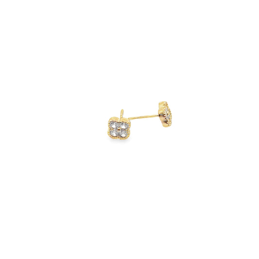 A pair of gold four-leaf clover stud earrings rests against a clean white background.