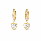Elegant 18K Gold Filled pave huggie earrings featuring sparkling heart-cut CZ drop charms. Lightweight, hypoallergenic, tarnish resistant, and perfect for everyday wear or gifting.