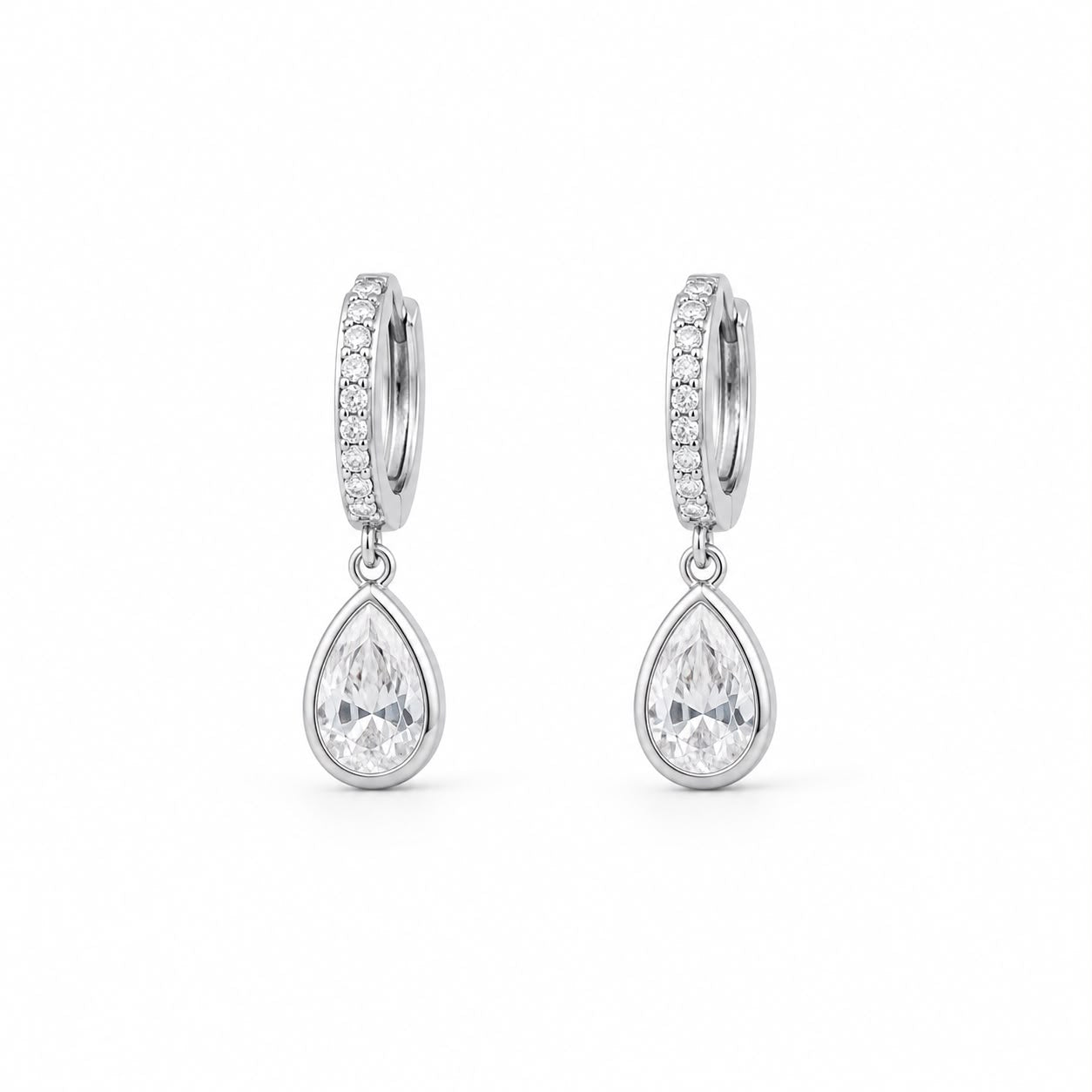 Shop pear-cut CZ drop huggie earrings featuring sparkling pavé hoops and teardrop cubic zirconia stones. 18K Gold Filled in Gold and Rhodium.