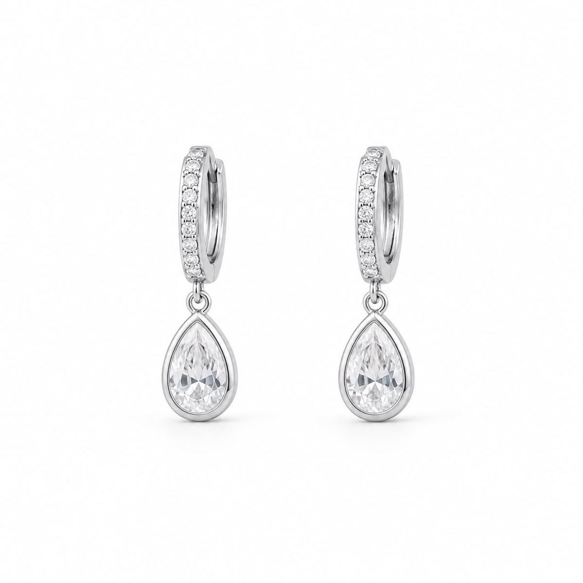 A pair of elegant silver hoop earrings feature dangling pear-shaped cubic zirconia stones against a clean white background.