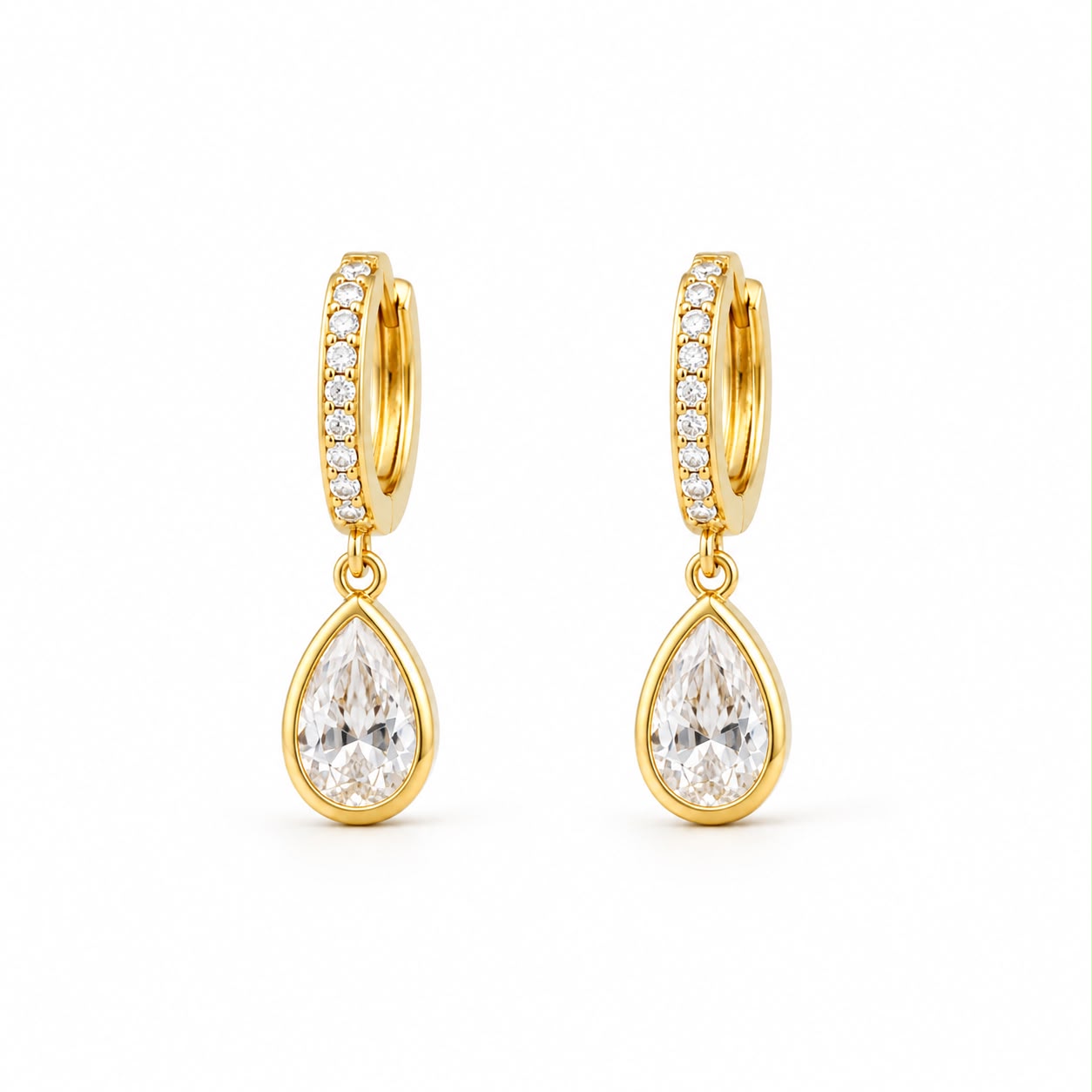 Shop pear-cut CZ drop huggie earrings featuring sparkling pavé hoops and teardrop cubic zirconia stones. 18K Gold Filled in Gold and Rhodium.