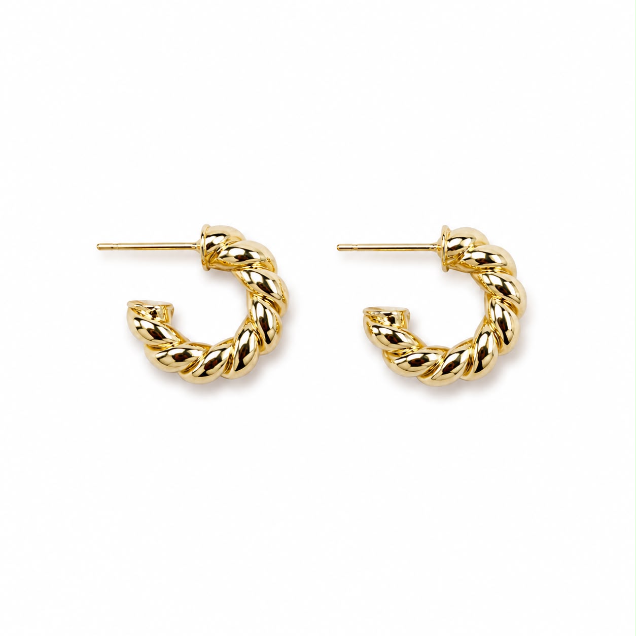 Classic twisted rope hoop earrings crafted in 18K Gold Filled and Rhodium. Lightweight, polished, hypoallergenic hoops for everyday wear.