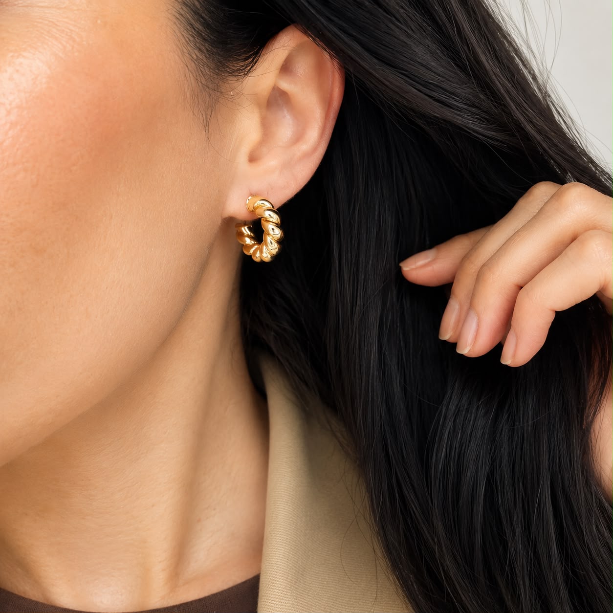 Classic twisted rope hoop earrings crafted in 18K Gold Filled and Rhodium. Lightweight, polished, hypoallergenic hoops for everyday wear.