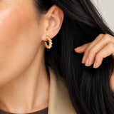 Classic twisted rope hoop earrings crafted in 18K Gold Filled and Rhodium. Lightweight, polished, hypoallergenic hoops for everyday wear.