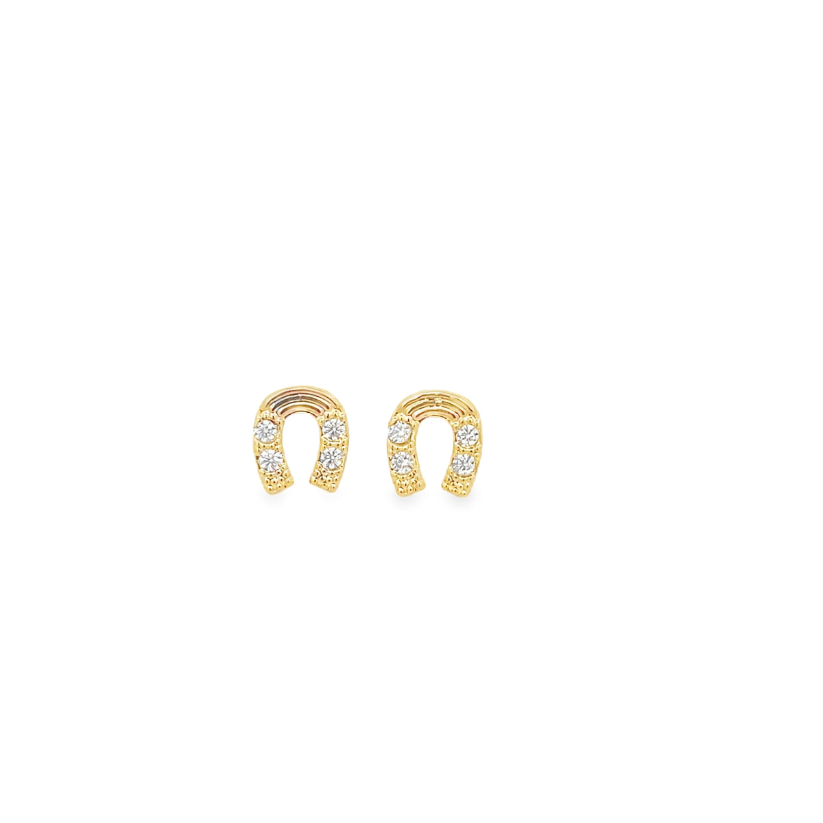 A pair of gold horseshoe stud earrings sparkled with embedded diamonds against a plain white background.