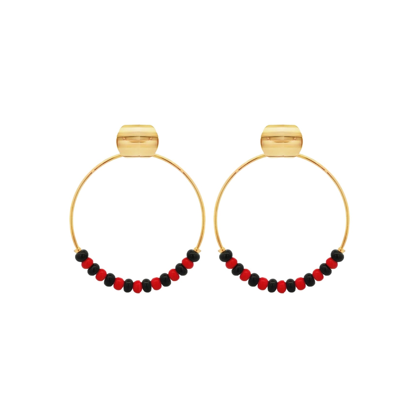 A pair of gold hoop earrings features alternating red and black beads along the bottom half, displayed against a clean white background.