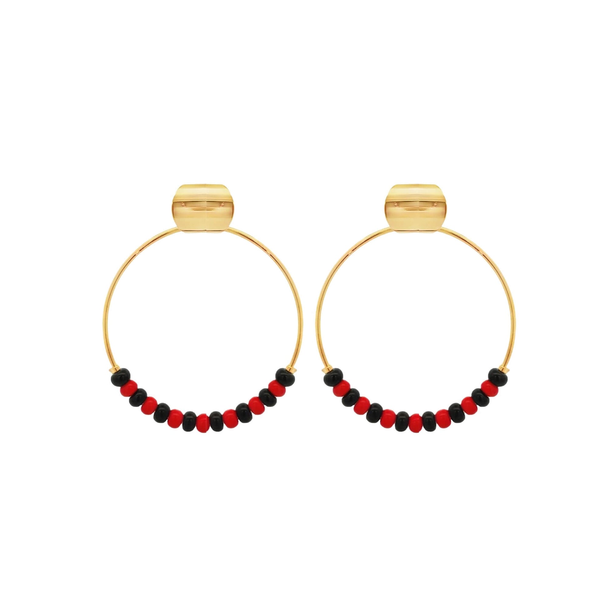 A pair of gold hoop earrings features alternating red and black beads along the bottom half, displayed against a clean white background.