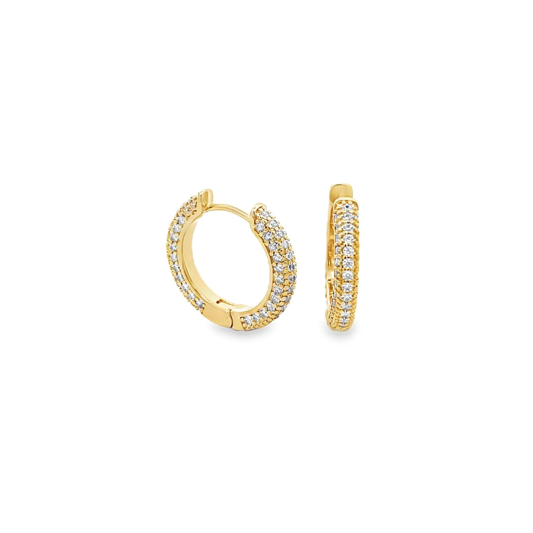 A pair of gold huggie hoop earrings sparkles with rows of small pavé-set diamonds against a clean white background.