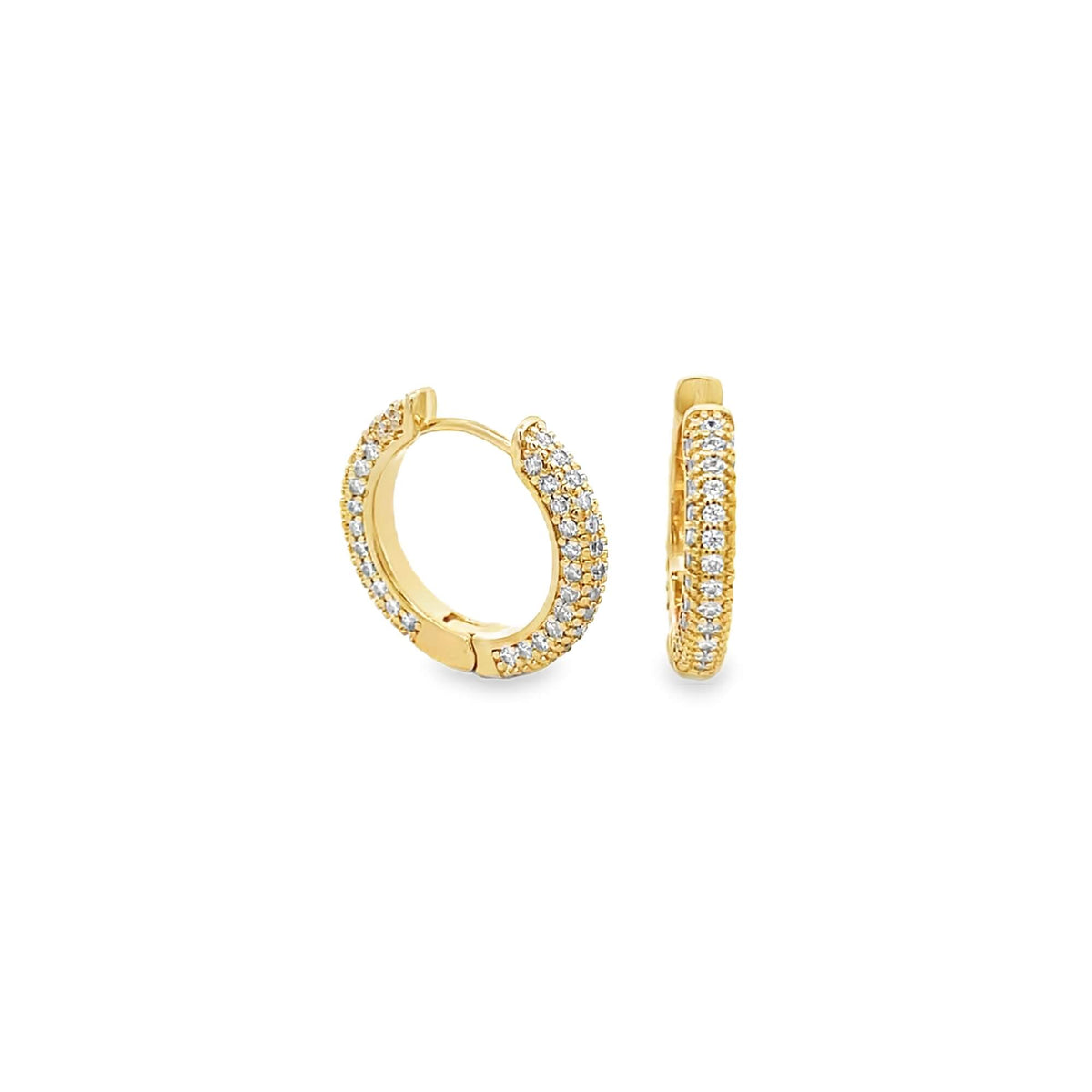 A pair of gold huggie hoop earrings sparkles with rows of small pavé-set diamonds against a clean white background.