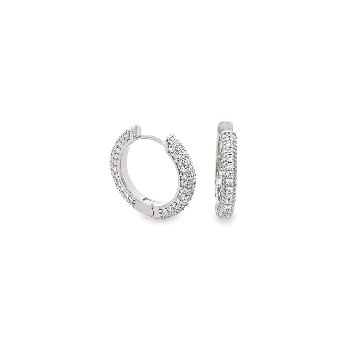 A pair of sparkling diamond pave huggie hoop earrings glitters against a clean white background.