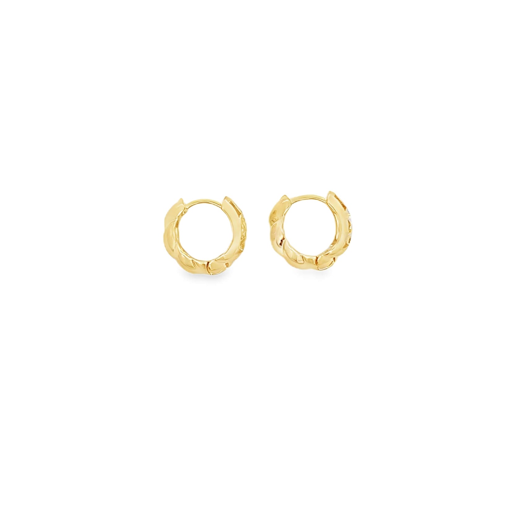 A pair of textured gold hoop earrings rests against a clean white background.