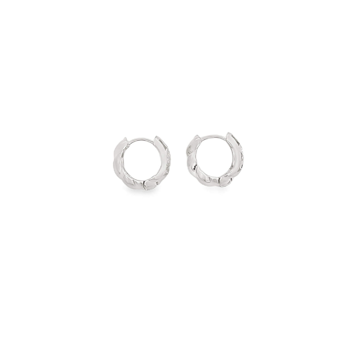 A pair of small, textured silver hoop earrings rests against a clean white background.