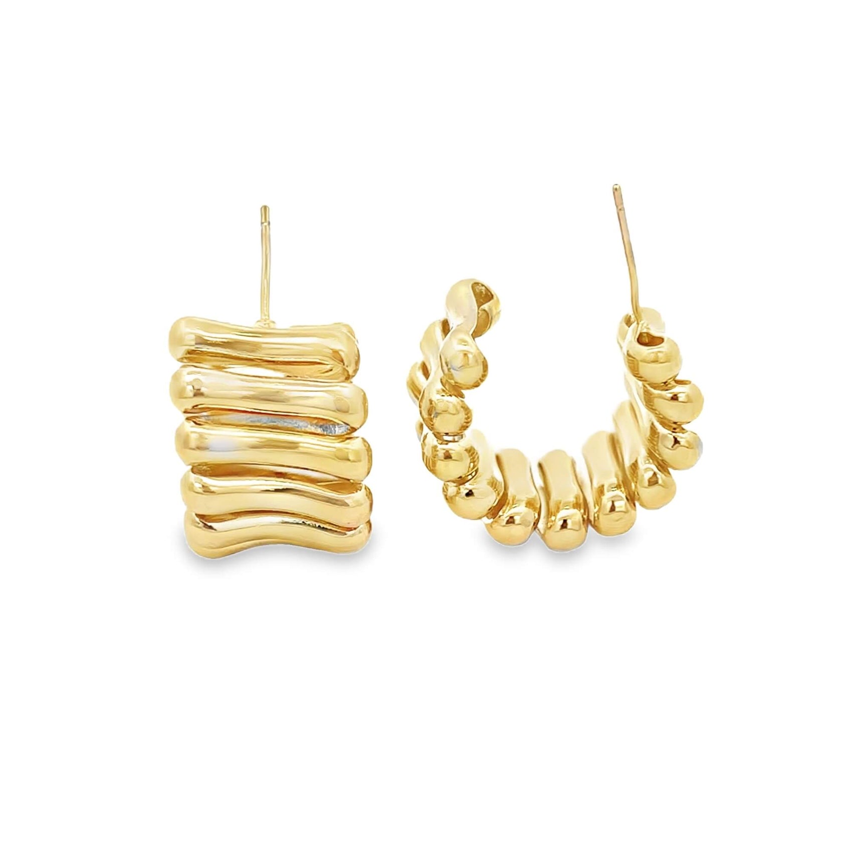 A pair of gold-plated, ridged hoop earrings gleams against a clean white background.