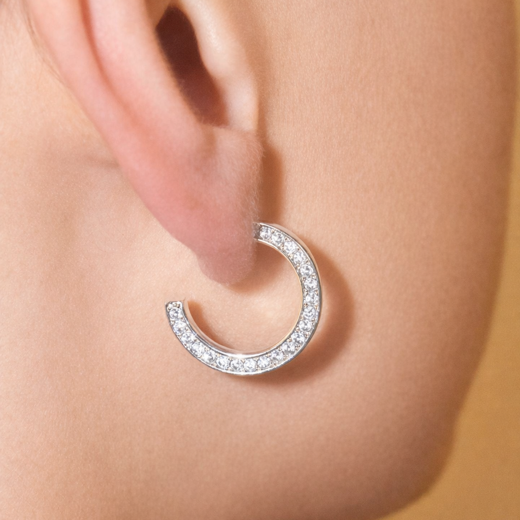 Modern pavé open hoop earrings with CZ stones. Minimalist half hoop design Perfect for everyday wear or layering.