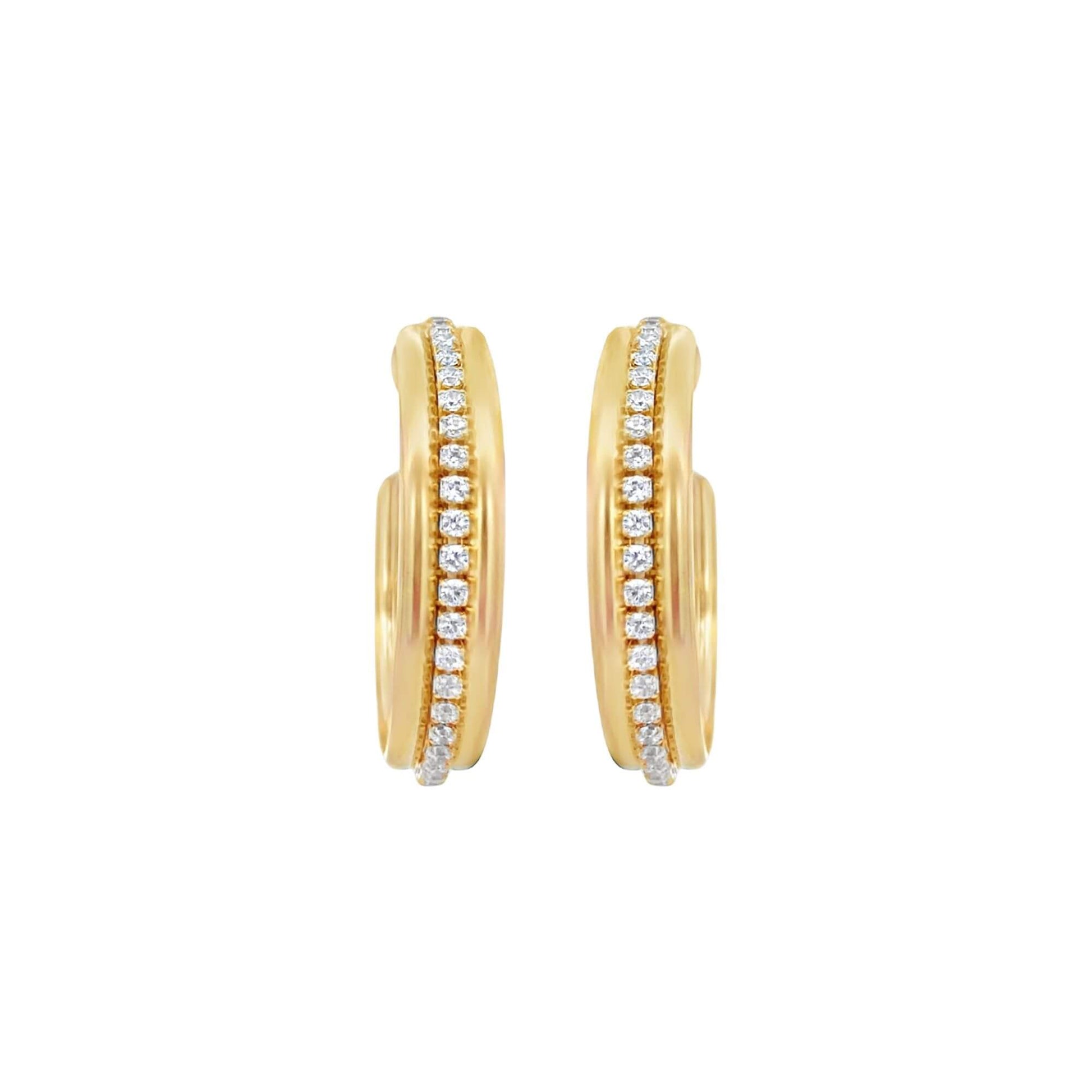 A pair of elegant gold huggie hoop earrings features a vertical channel of sparkling pavé-set diamonds down the center.