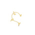 A delicate gold ear cuff features three dainty butterflies perched along its curved band.