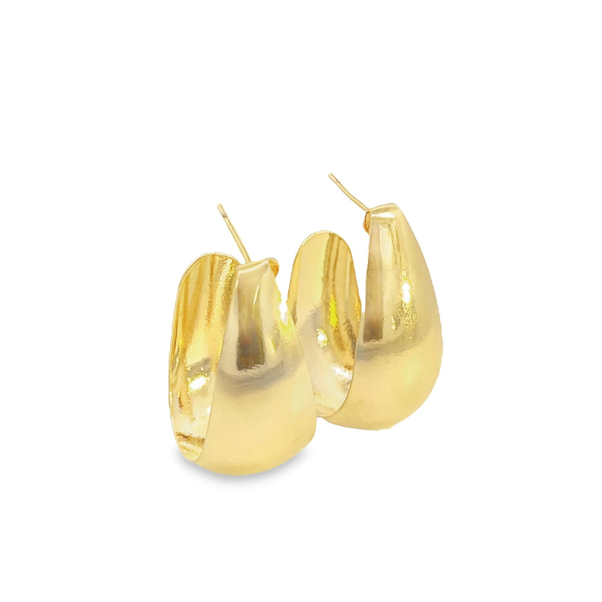 A pair of polished gold chunky hoop earrings catches the light against a white background.