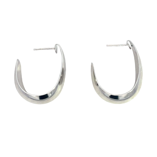 A pair of polished silver hoop earrings rest against a plain white background, showcasing their sleek, crescent-shaped design.