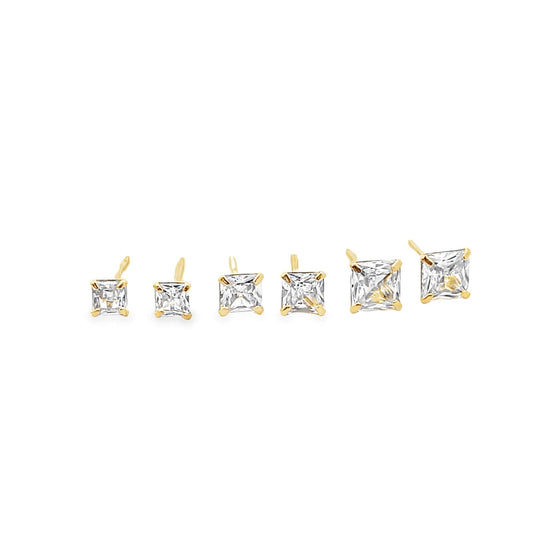 A row of six square princess-cut cubic zirconia stud earrings in varying sizes gleams against a clean white background.