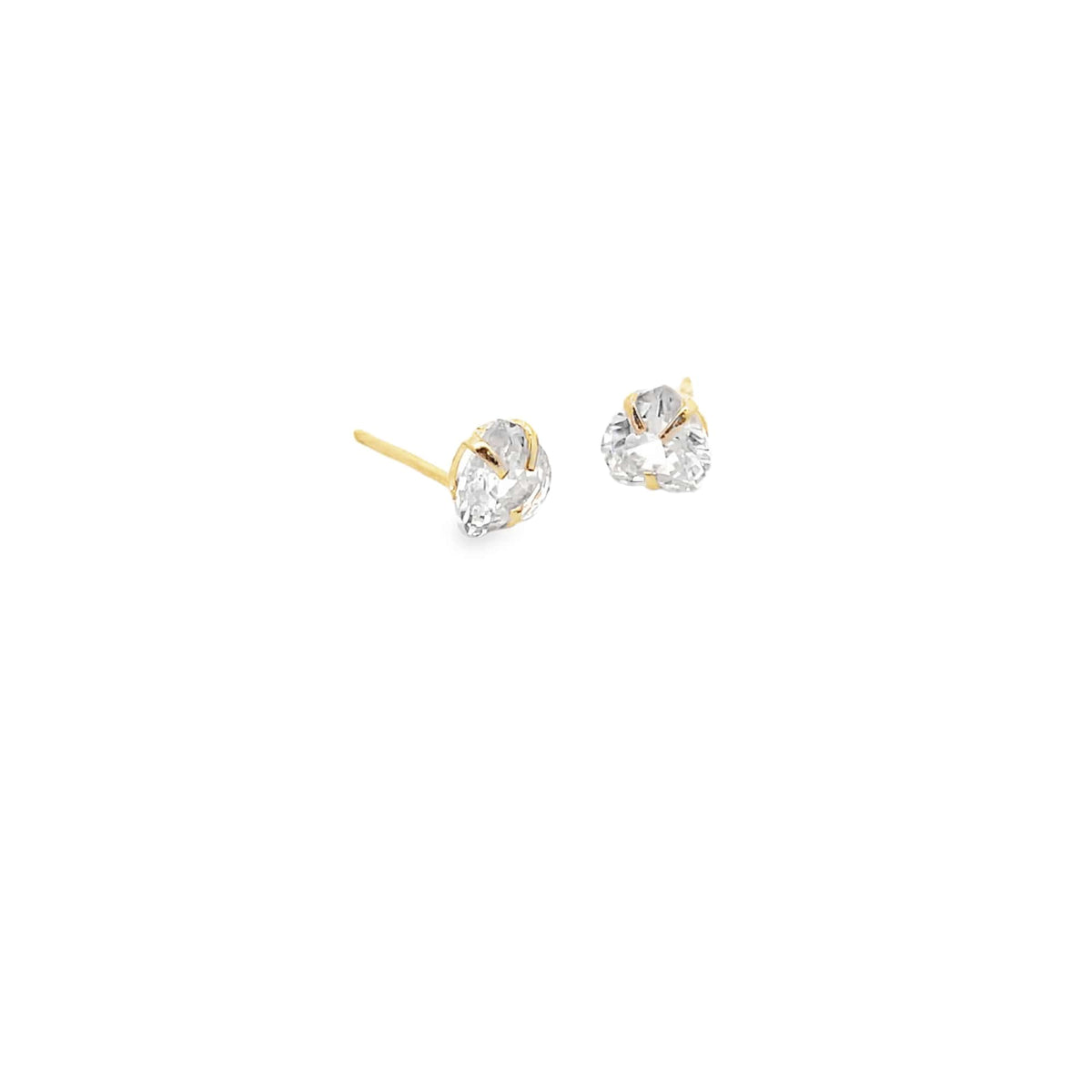 A pair of delicate gold heart-shaped diamond stud earrings rest against a clean white background.