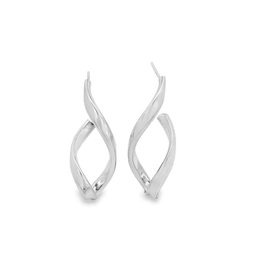 A pair of polished silver twist hoop earrings rests against a clean white background.
