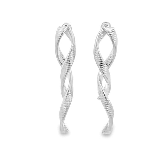 A pair of shiny silver twisted drop earrings hangs vertically against a clean white background.