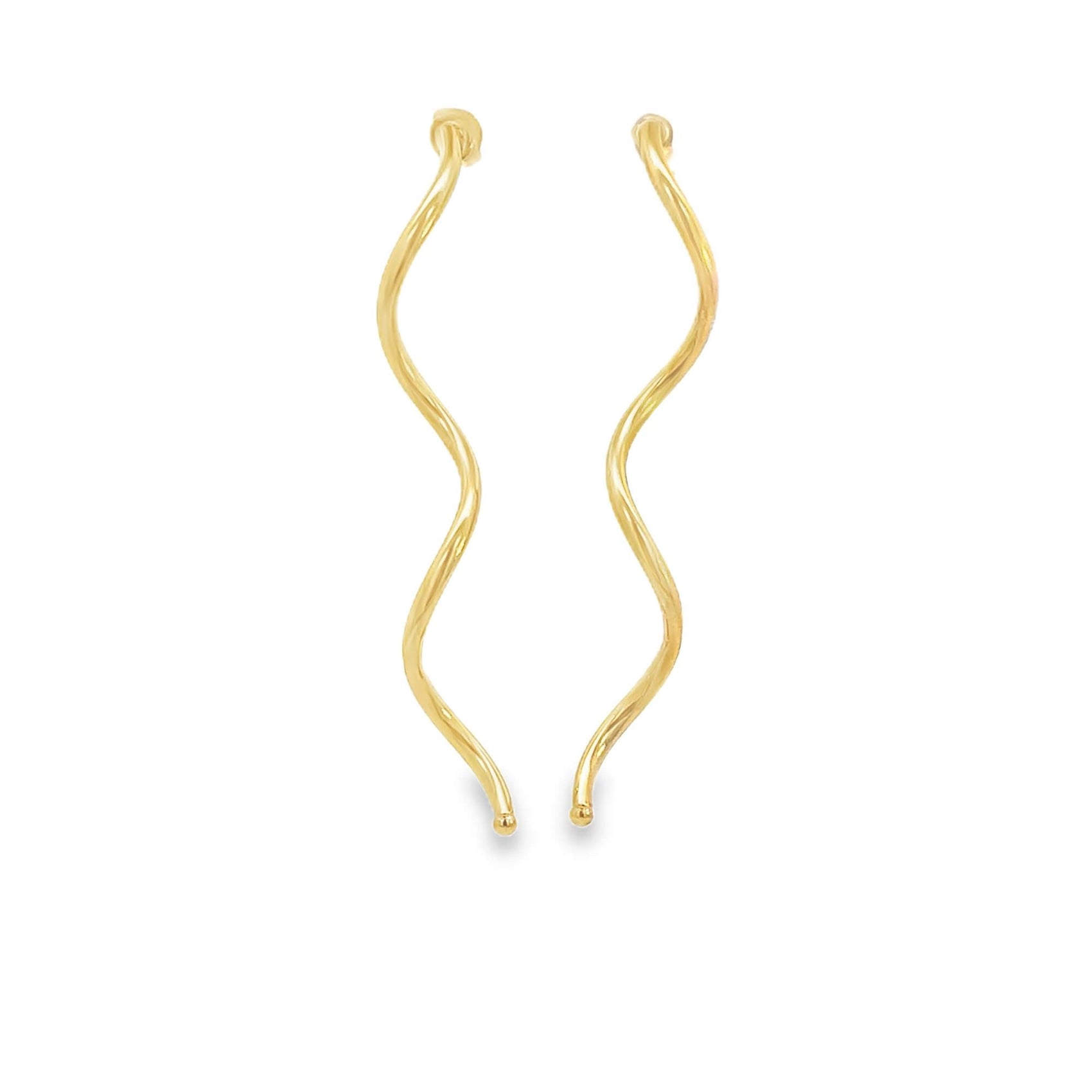 A pair of elegant gold wavy earrings hangs gracefully against a white background.
