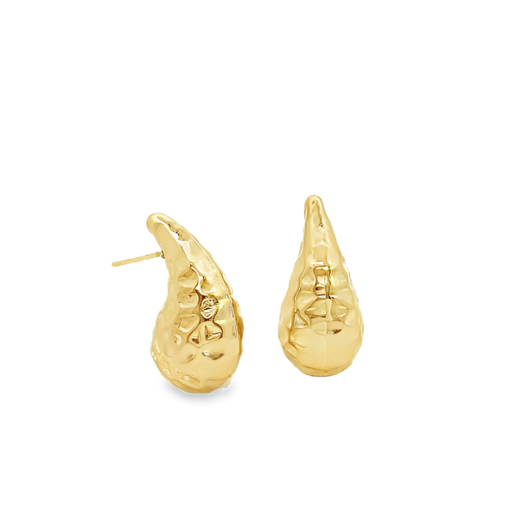 A pair of textured, teardrop-shaped gold stud earrings rests against a clean white background.