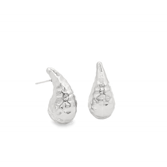 A pair of shiny silver teardrop-shaped stud earrings features a textured, hammered surface against a clean white background.