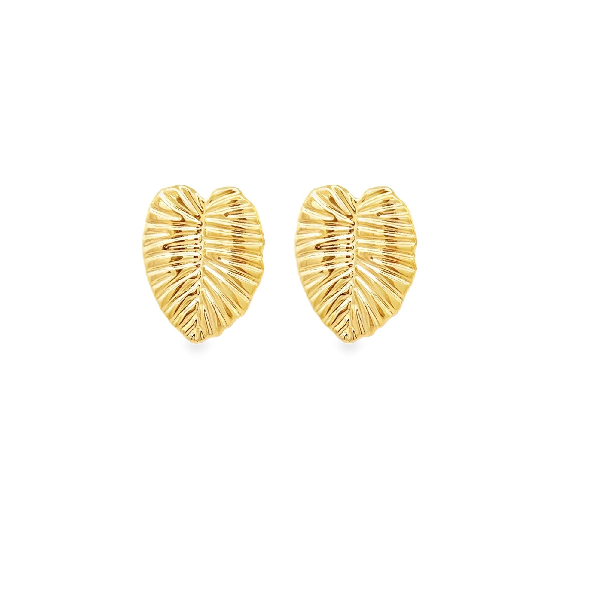 Pair of gold leaf-shaped earrings on a white background