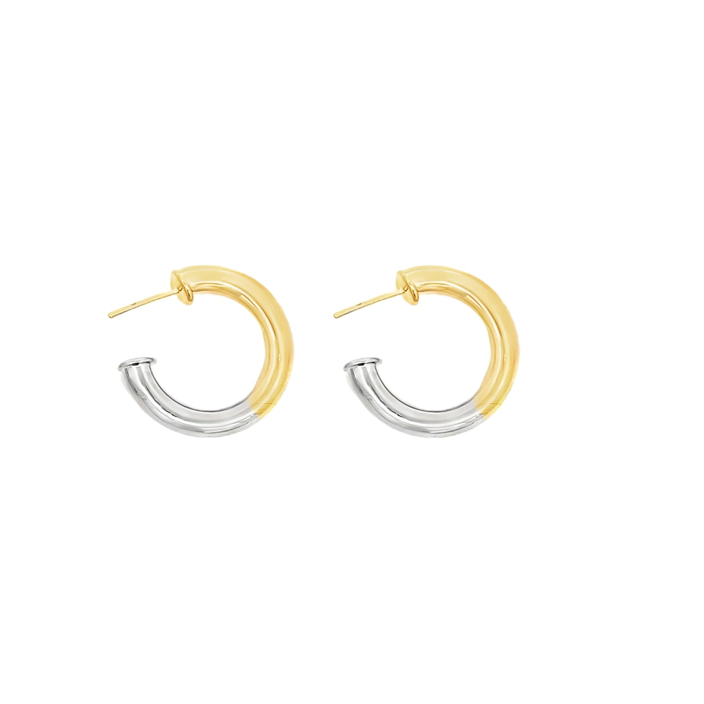 A pair of two-tone hoop earrings features a split design of polished gold and silver metal against a clean white background.
