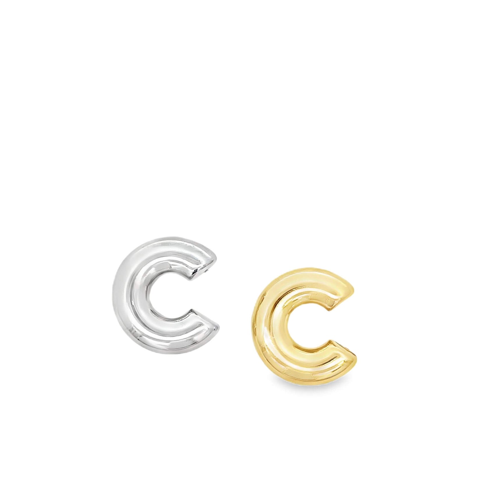 A pair of silver and gold initial C balloon-style stud earrings rest side by side against a clean white background.