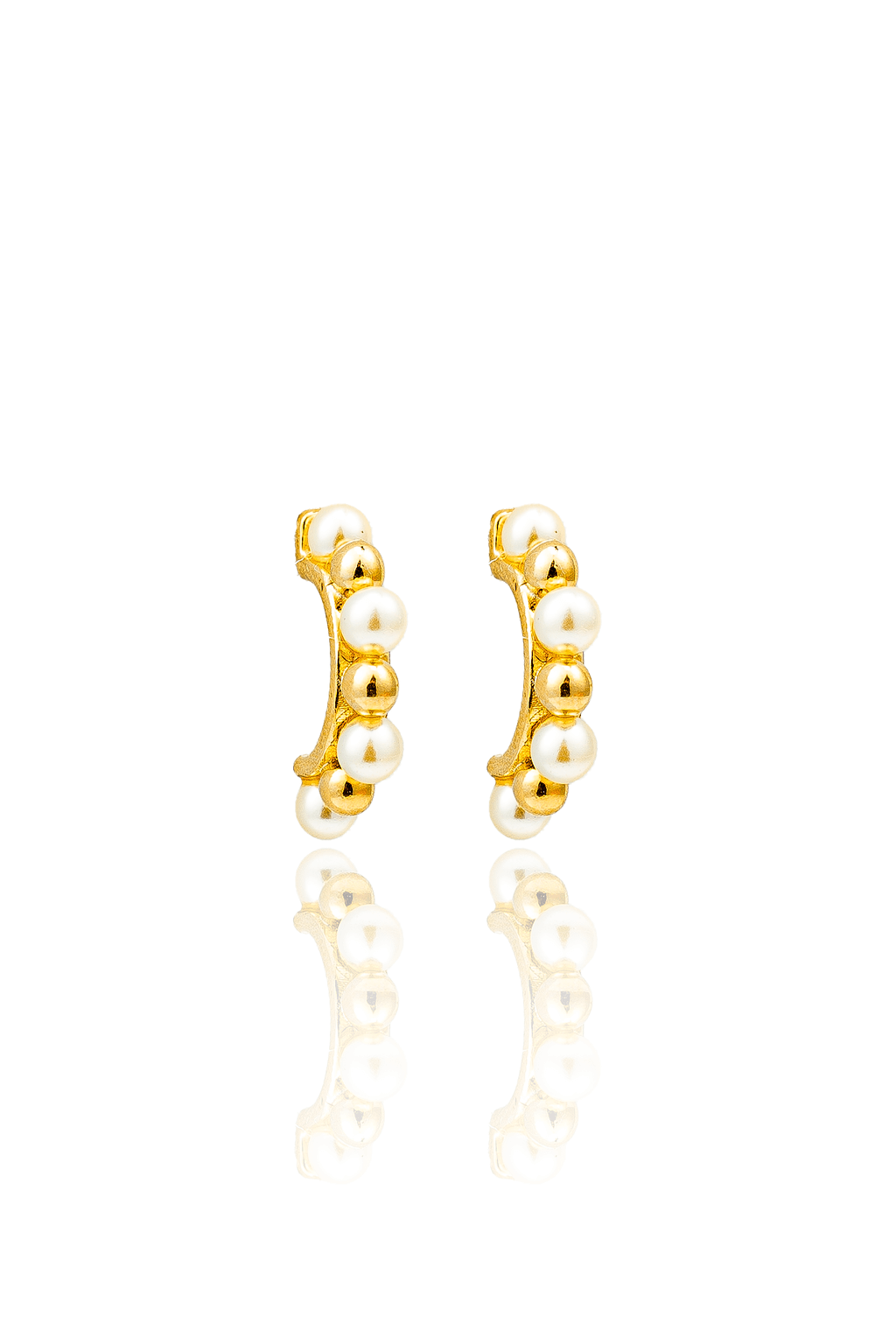 A pair of gold huggie earrings featuring alternating pearls and gold spheres displayed on a white reflective surface.