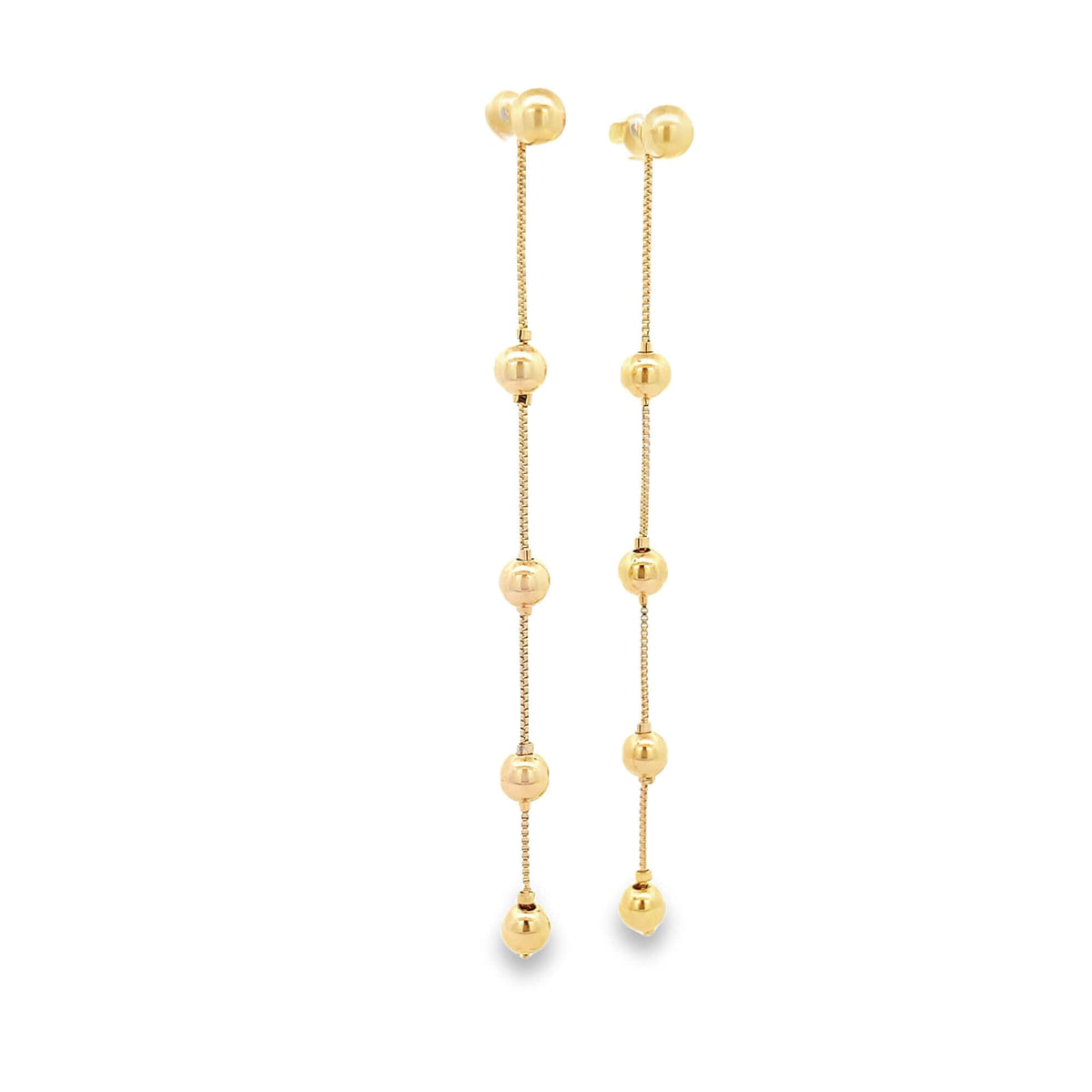 A pair of elegant 14k yellow gold drop earrings features dangling chains adorned with polished sphere beads against a white background.