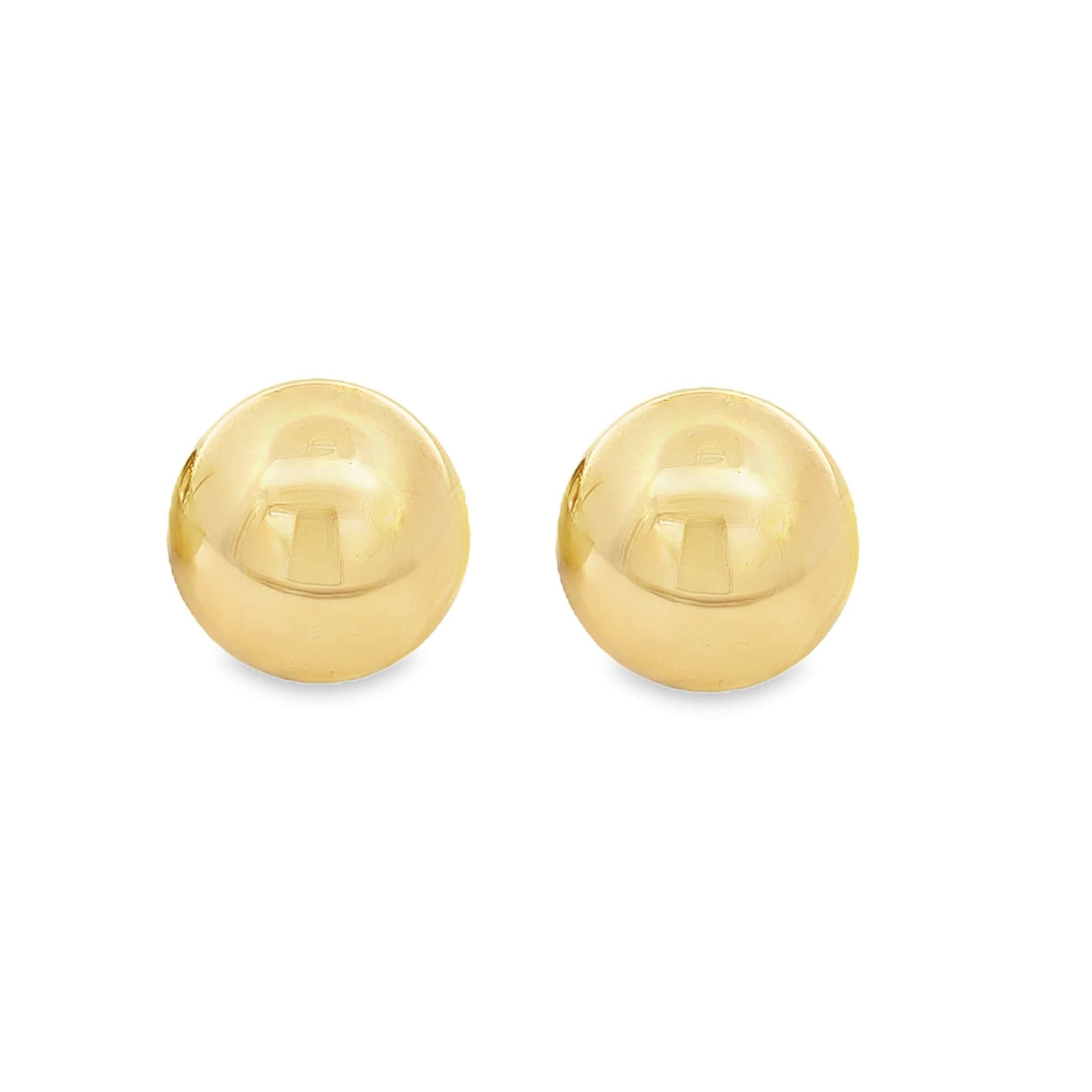 A pair of polished yellow gold ball stud earrings rests against a clean white background.