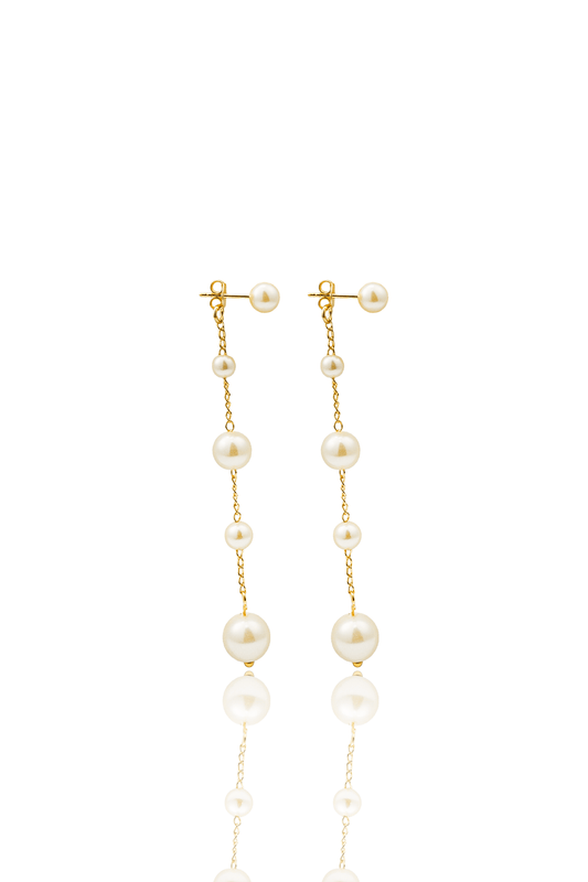 A pair of elegant gold chain drop earrings features alternating pearls of varying sizes against a clean white background.