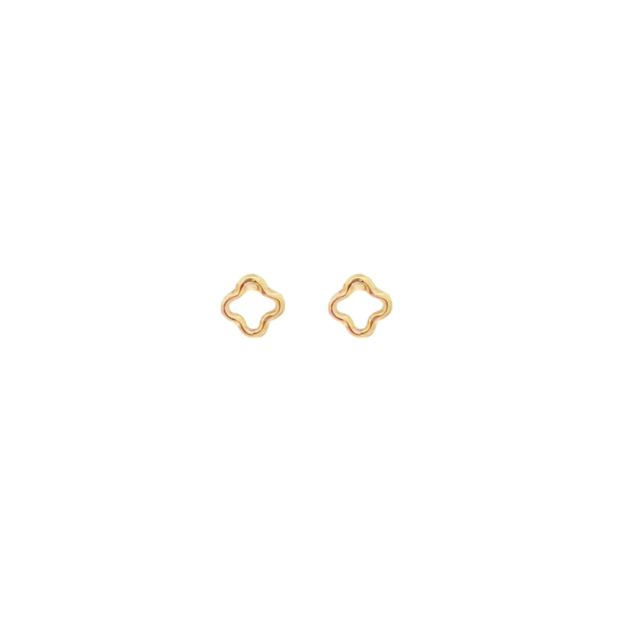 A pair of minimalist gold clover stud earrings rests against a clean white background.