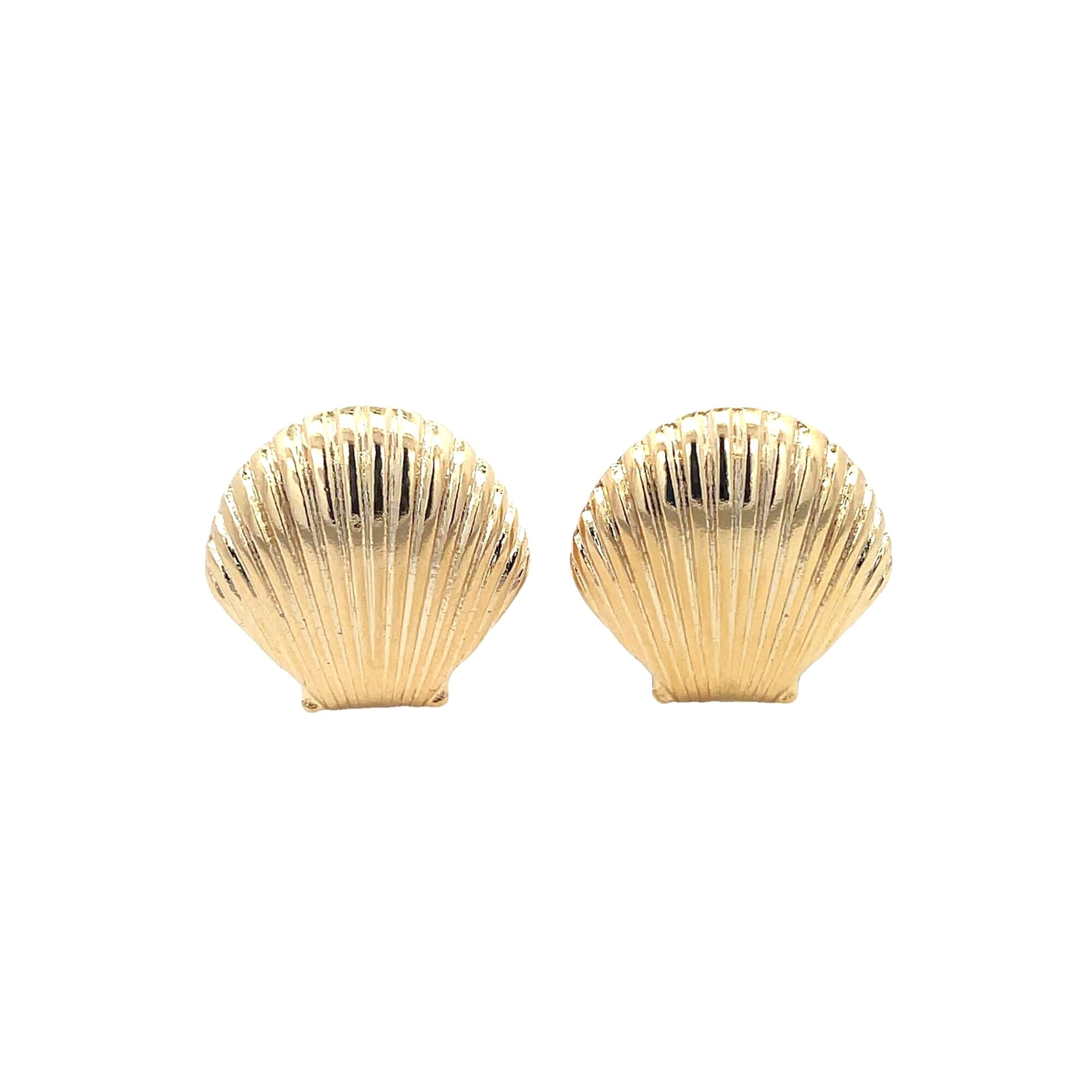 A pair of polished gold seashell stud earrings rest against a clean white background.