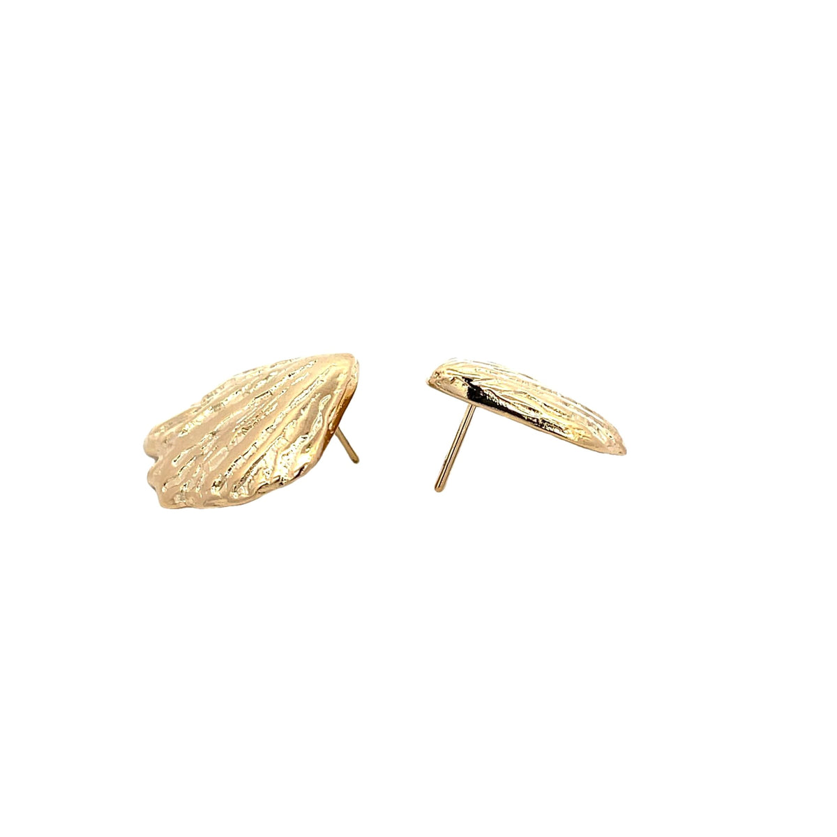 A pair of textured gold shell-shaped stud earrings rests against a clean white background.