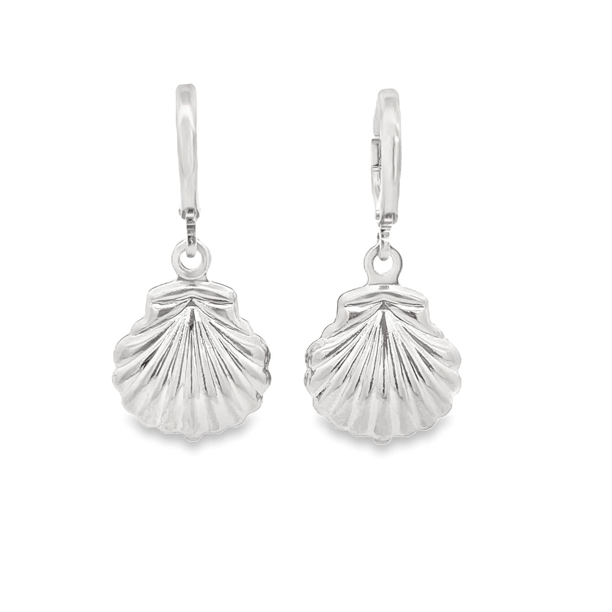 A pair of polished silver seashell charm hoop earrings sparkles against a clean white background.