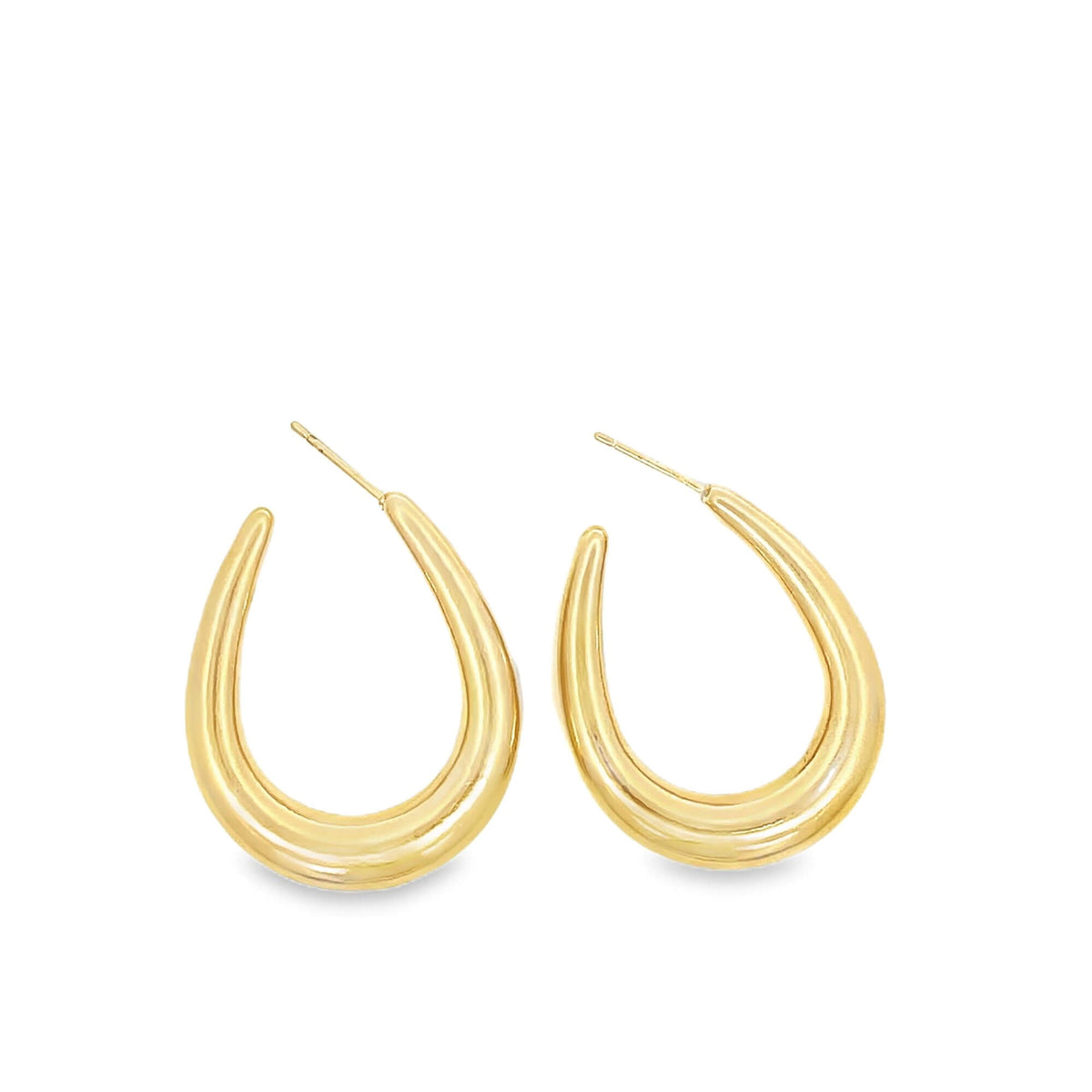 A pair of thick, polished gold hoop earrings rests against a clean white background.