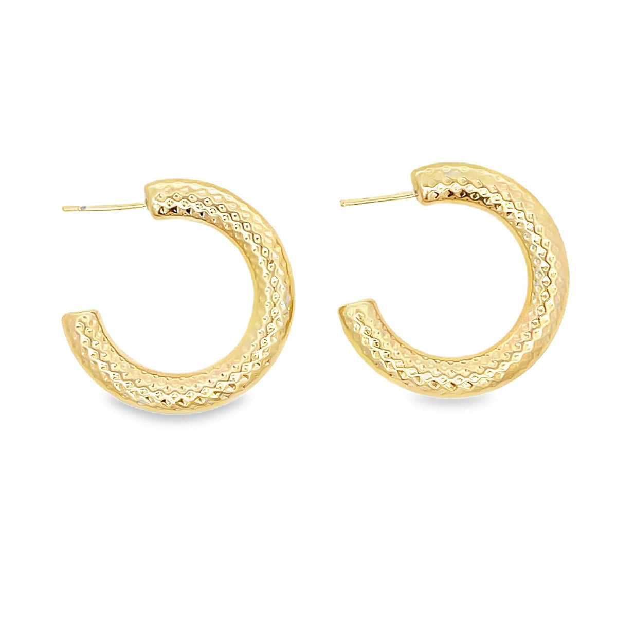 A pair of textured gold hoop earrings displays a detailed diamond-cut pattern against a plain white background.