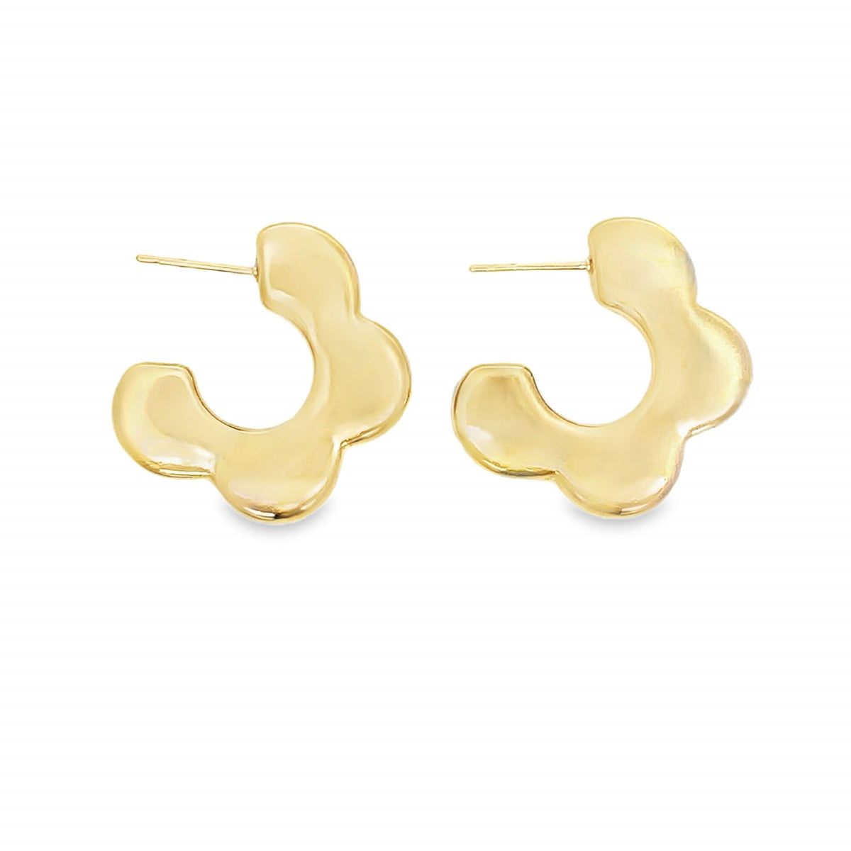 A pair of shiny gold floral huggie hoop earrings rests against a clean white background.