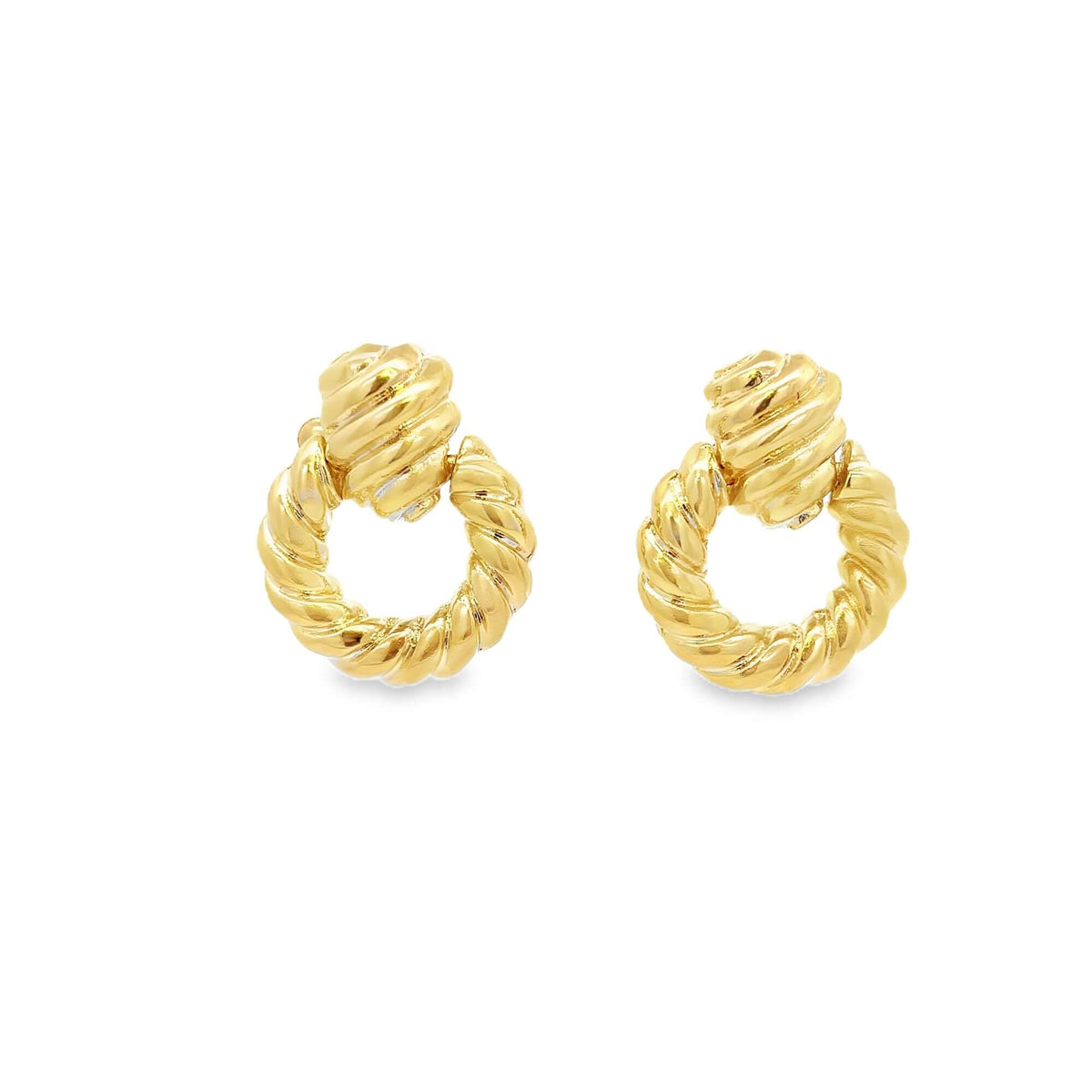 A pair of polished gold rope-textured hoop earrings gleams against a clean white background.