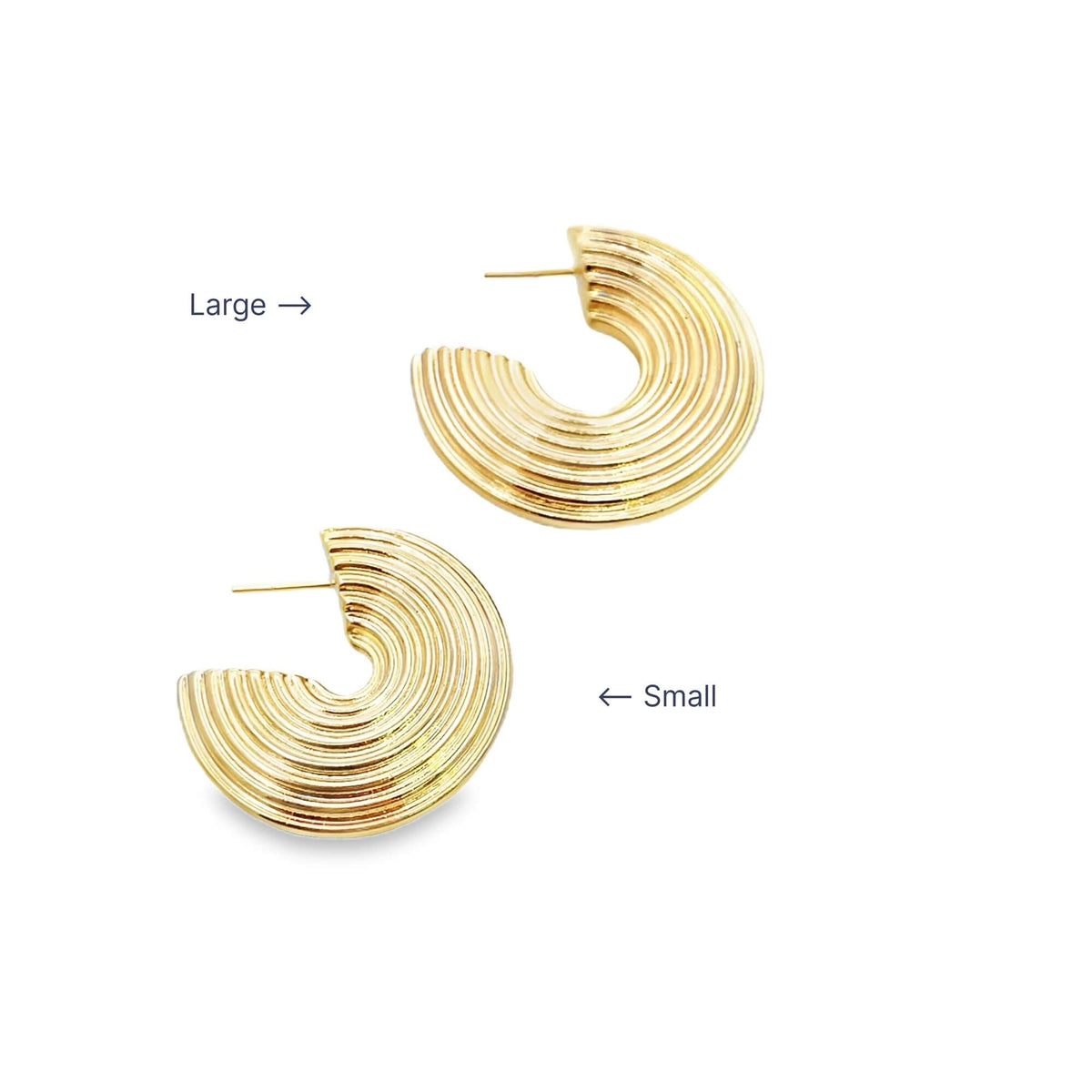 Two gold ribbed hoop earrings display their large and small sizes against a plain white background.