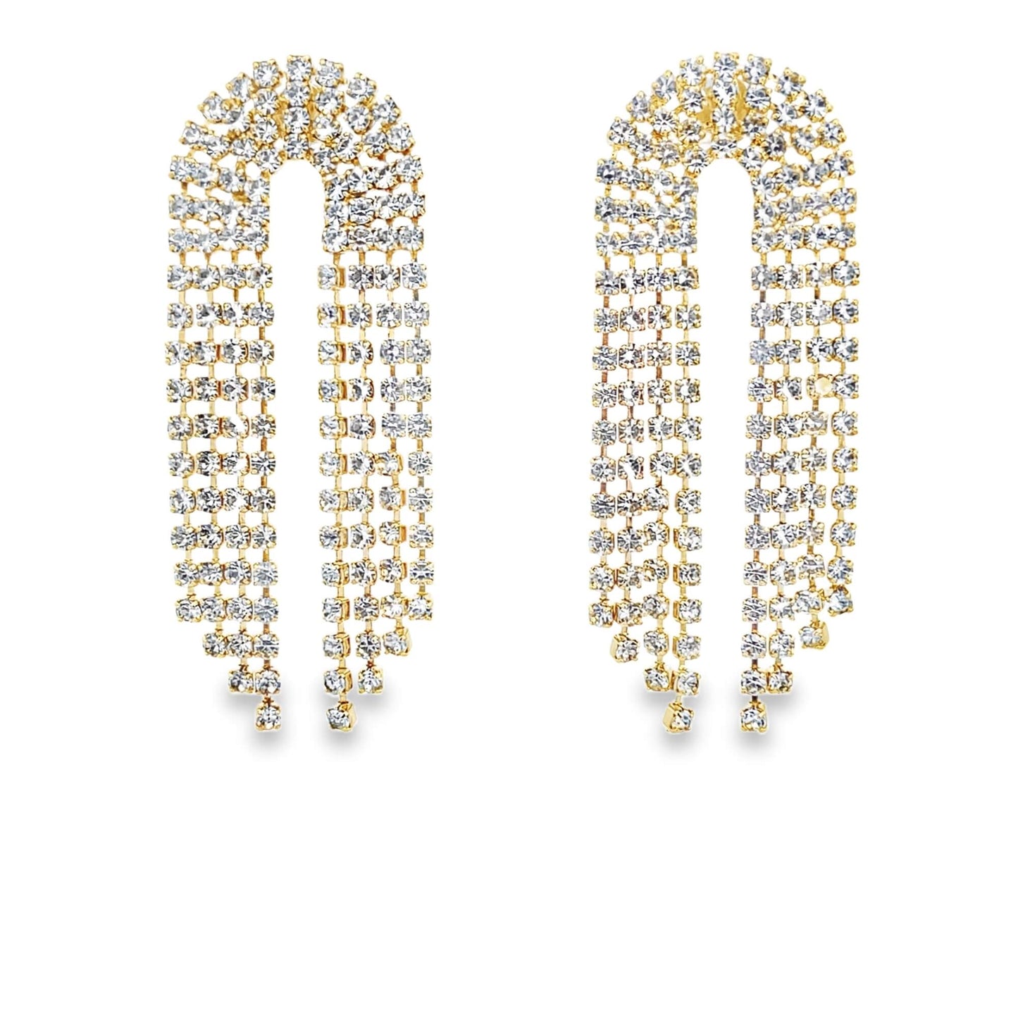 A pair of U-shaped gold rhinestone fringe earrings sparkle against a clean white background.