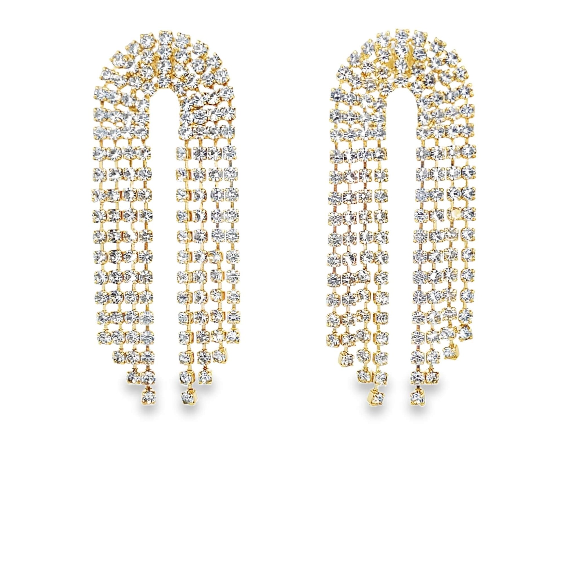 A pair of U-shaped gold rhinestone fringe earrings sparkle against a clean white background.