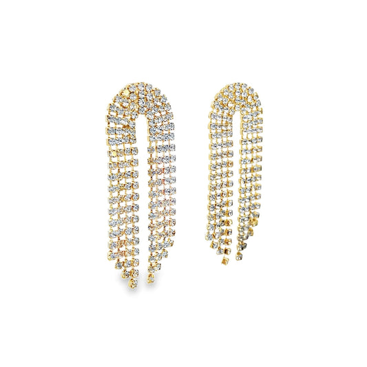 A pair of gold rhinestone fringe statement earrings sparkles against a clean white background.