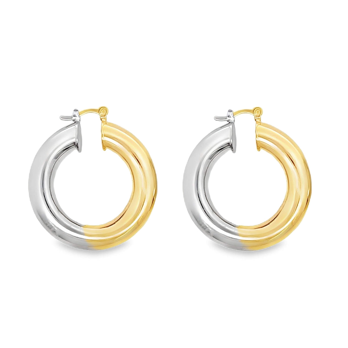 A pair of chunky two-tone hoop earrings displays a seamless blend of yellow gold and white silver against a clean white background.